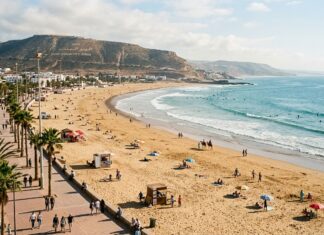 Agadir & Taghazout Travel Guide: Beaches, Surfing & Souss Valley Agadir crescent beach and ocean promenade with hill inscription
