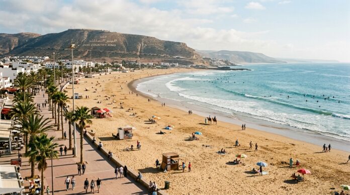 Agadir & Taghazout Travel Guide: Beaches, Surfing & Souss Valley Agadir crescent beach and ocean promenade with hill inscription