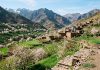 Best Time to Visit Morocco: Weather, Seasons & Month-by-Month Guide Spring blooming almond trees and stone houses in Morocco Atlas valley