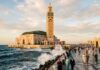 Casablanca Travel Guide: The Complete Modern Metropolis Guide Hassan II Mosque minaret overlooking the Atlantic Ocean in Casablanca Morocco