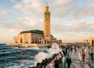 Casablanca Travel Guide: The Complete Modern Metropolis Guide Hassan II Mosque minaret overlooking Atlantic Ocean in Casablanca Morocco