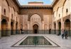 Moroccan Riads: Everything You Need to Know Before Booking Central courtyard and reflecting pool of Ben Youssef Madrassa in Marrakech Morocco