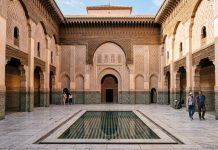 Moroccan Riads: Everything You Need to Know Before Booking Central courtyard and reflecting pool of Ben Youssef Madrassa in Marrakech Morocco