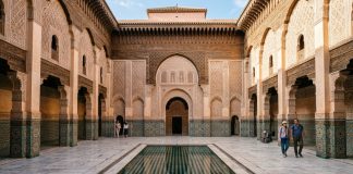 Moroccan Riads: Everything You Need to Know Before Booking Central courtyard and reflecting pool of Ben Youssef Madrassa in Marrakech Morocco