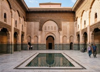 Moroccan Riads: Everything You Need to Know Before Booking Central courtyard and reflecting pool of Ben Youssef Madrassa in Marrakech Morocco