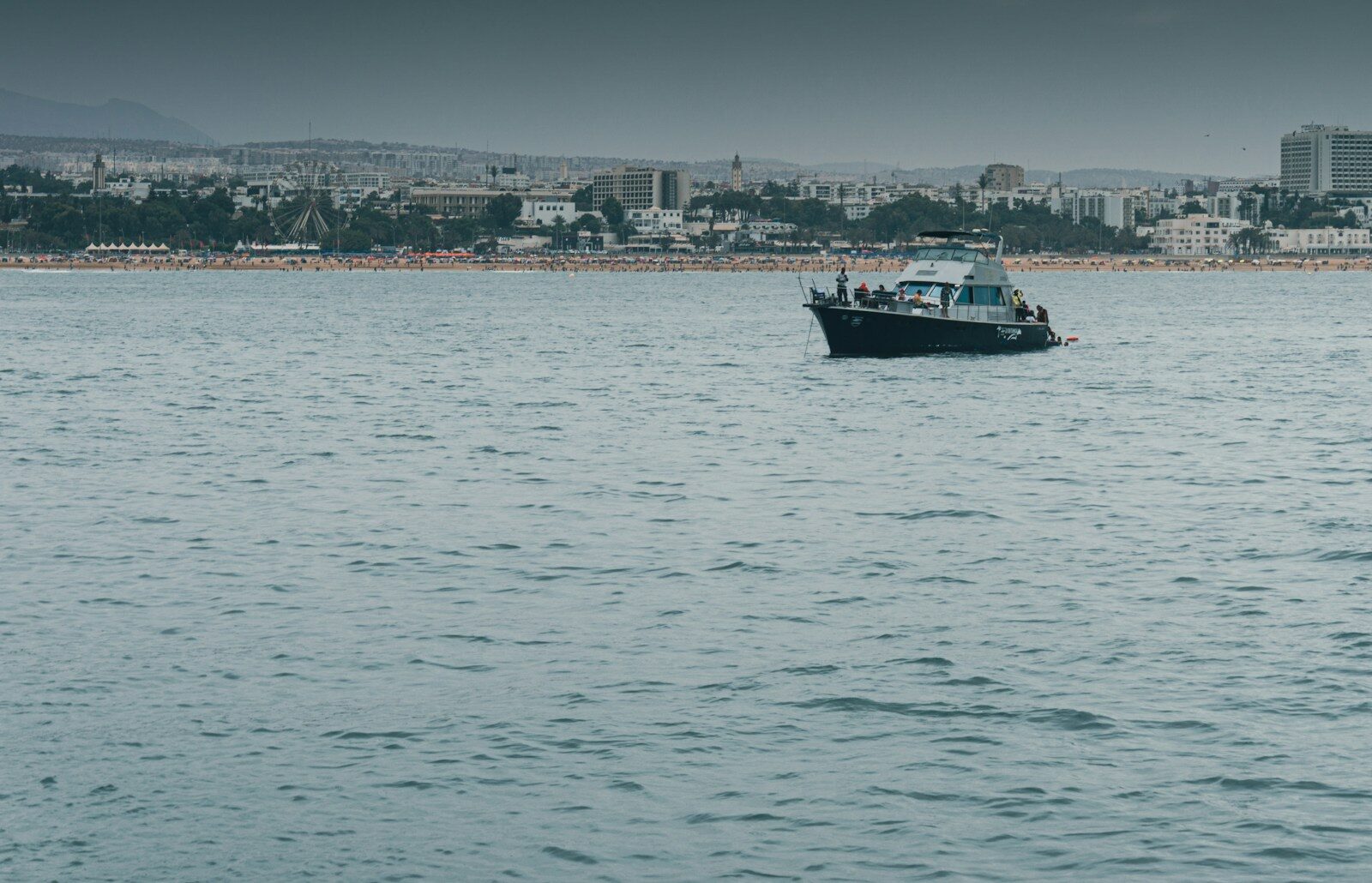 Agadir city: a red and white fishing boat on the Atlantic