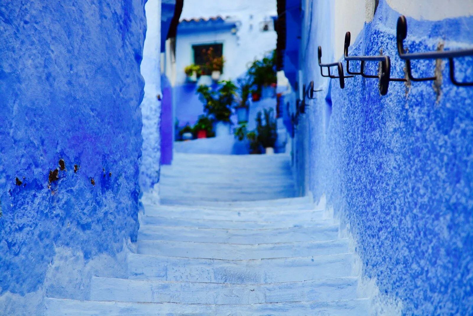 Blue-washed steps in Chefchaouen, one of the best places to see in Morocco