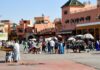 Morocco Travel Safety: 15 Worst Mistakes Tourists Make Busy market square with vendors in Marrakech, where Morocco safety tips on scams and agreeing prices matter most