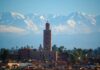 Moroccan Marrakech Guide: 10 Must-See Sights, Riads, Costs and Safety Moroccan Marrakech skyline with the Koutoubia minaret and the snow-capped Atlas Mountains