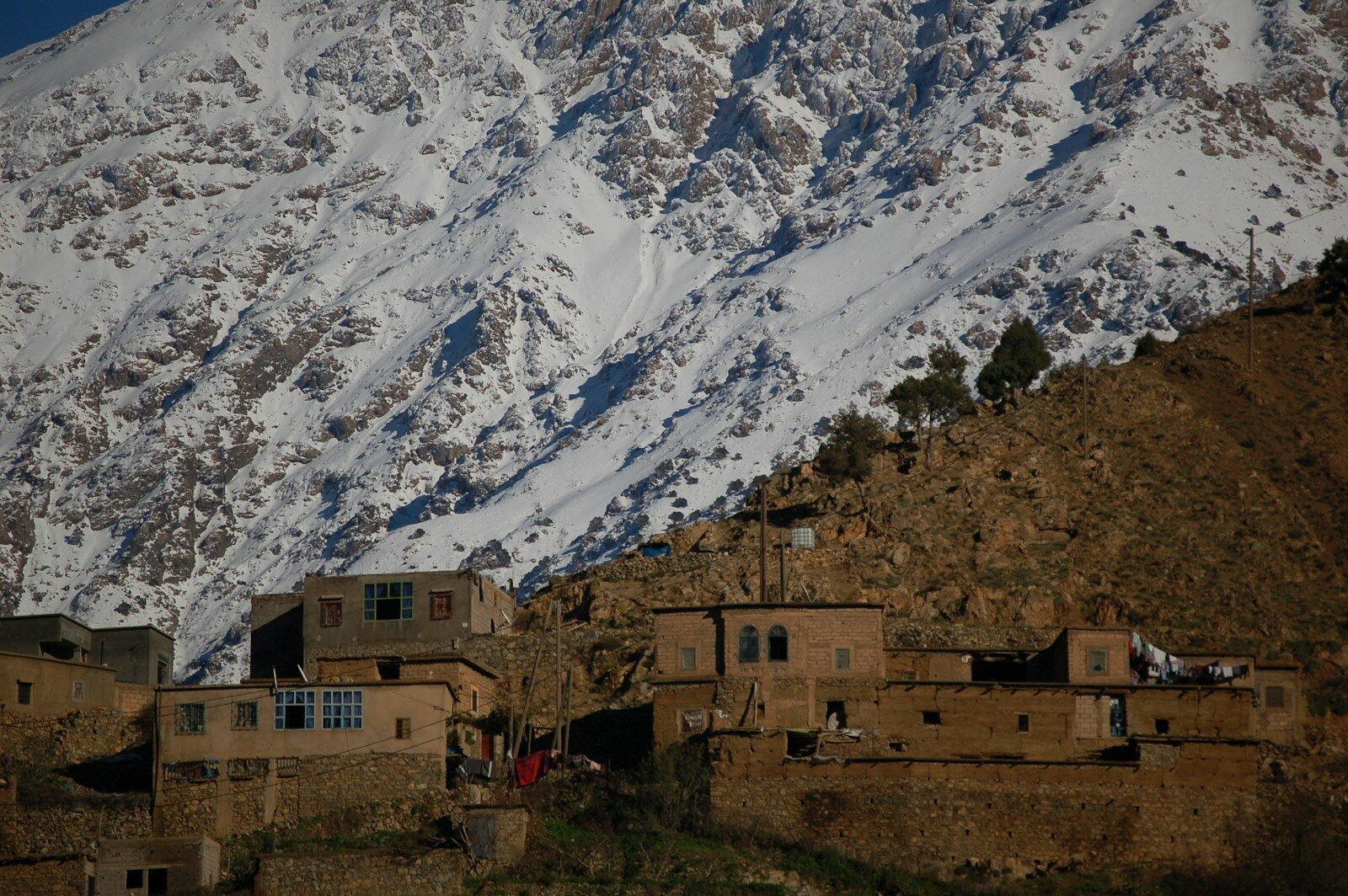 Morocco Marrakech excursions: an earthen village below the snowy Atlas Mountains