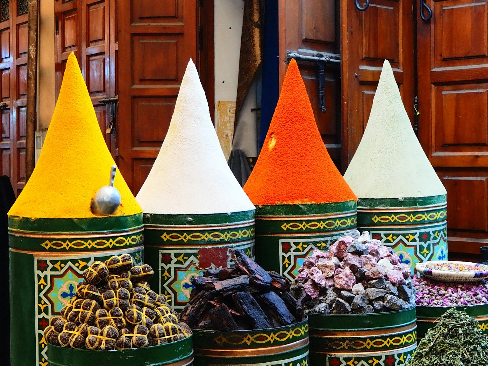 Things to see in Agadir: colorful spices piled in cones at a Moroccan souk